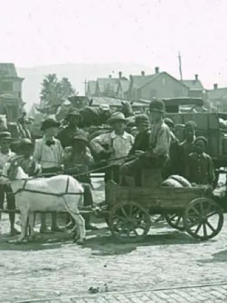 Street scene, goat cart and children.