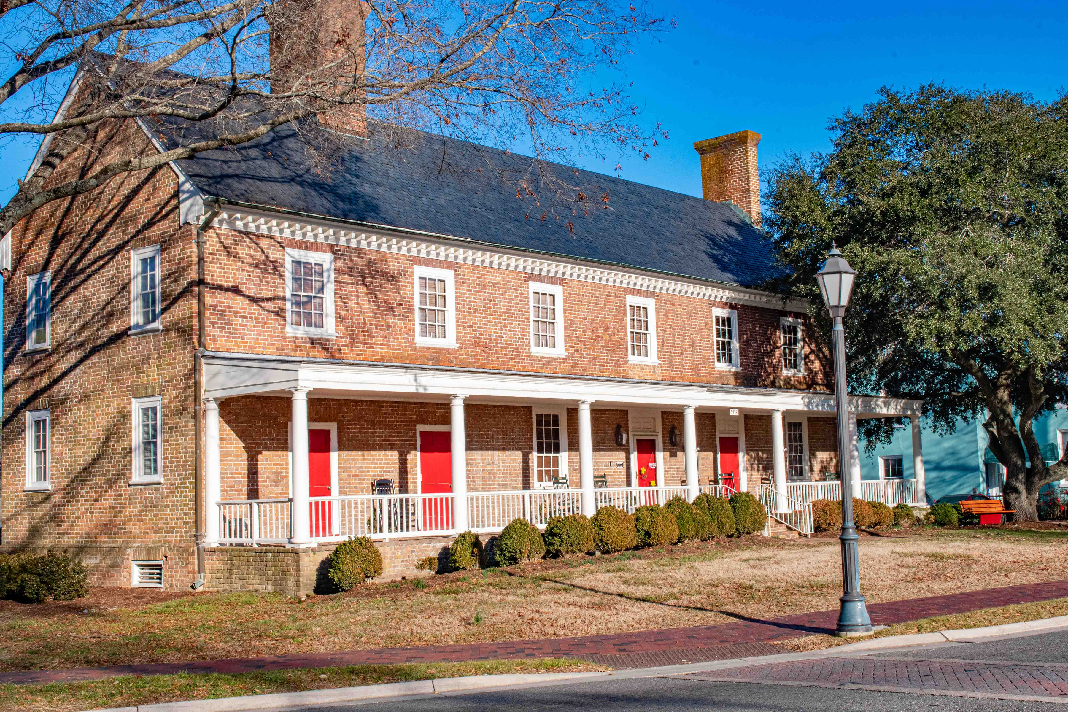 Gloucester Museum of History - a two story brick building with red shutters