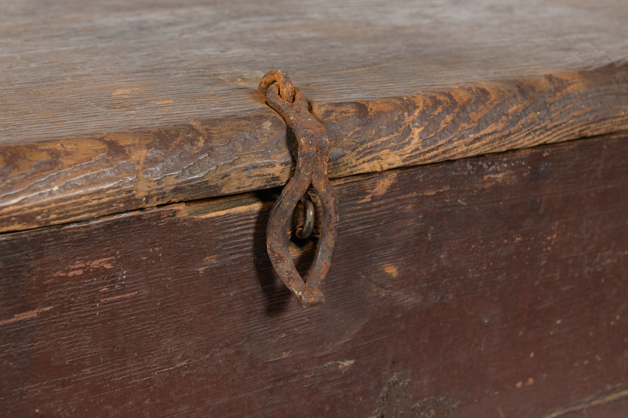 A detail of a handmade clasp on a wooden chest