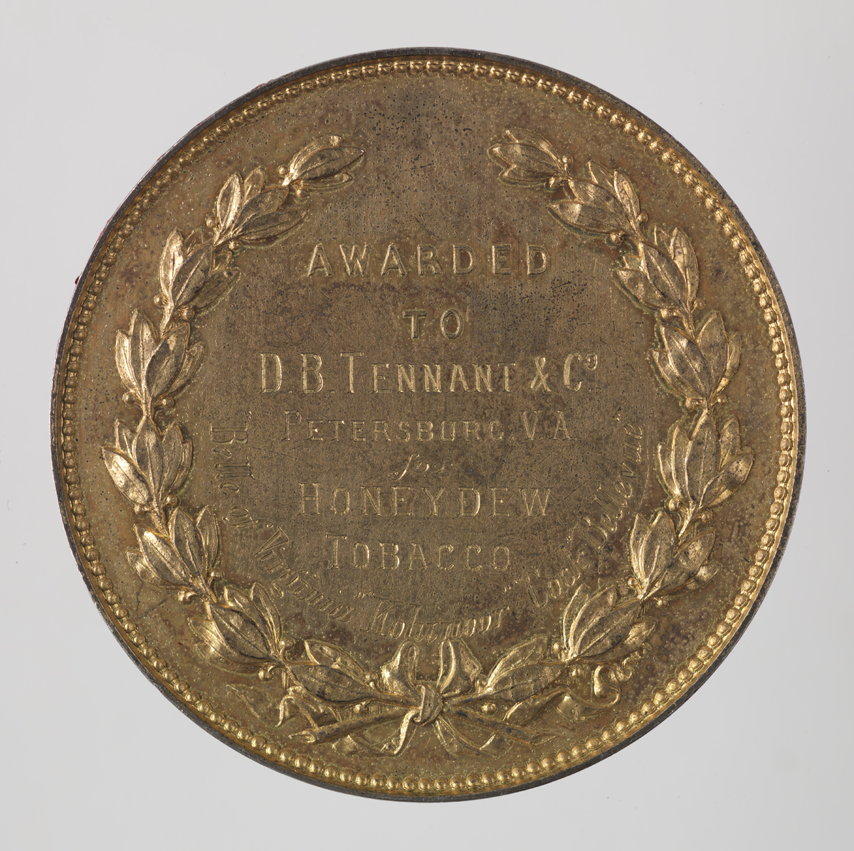 Gold Medal (Back) awarded to D.B. Tenant & Co. at the Calcutta International Exhibition, 1883-1884