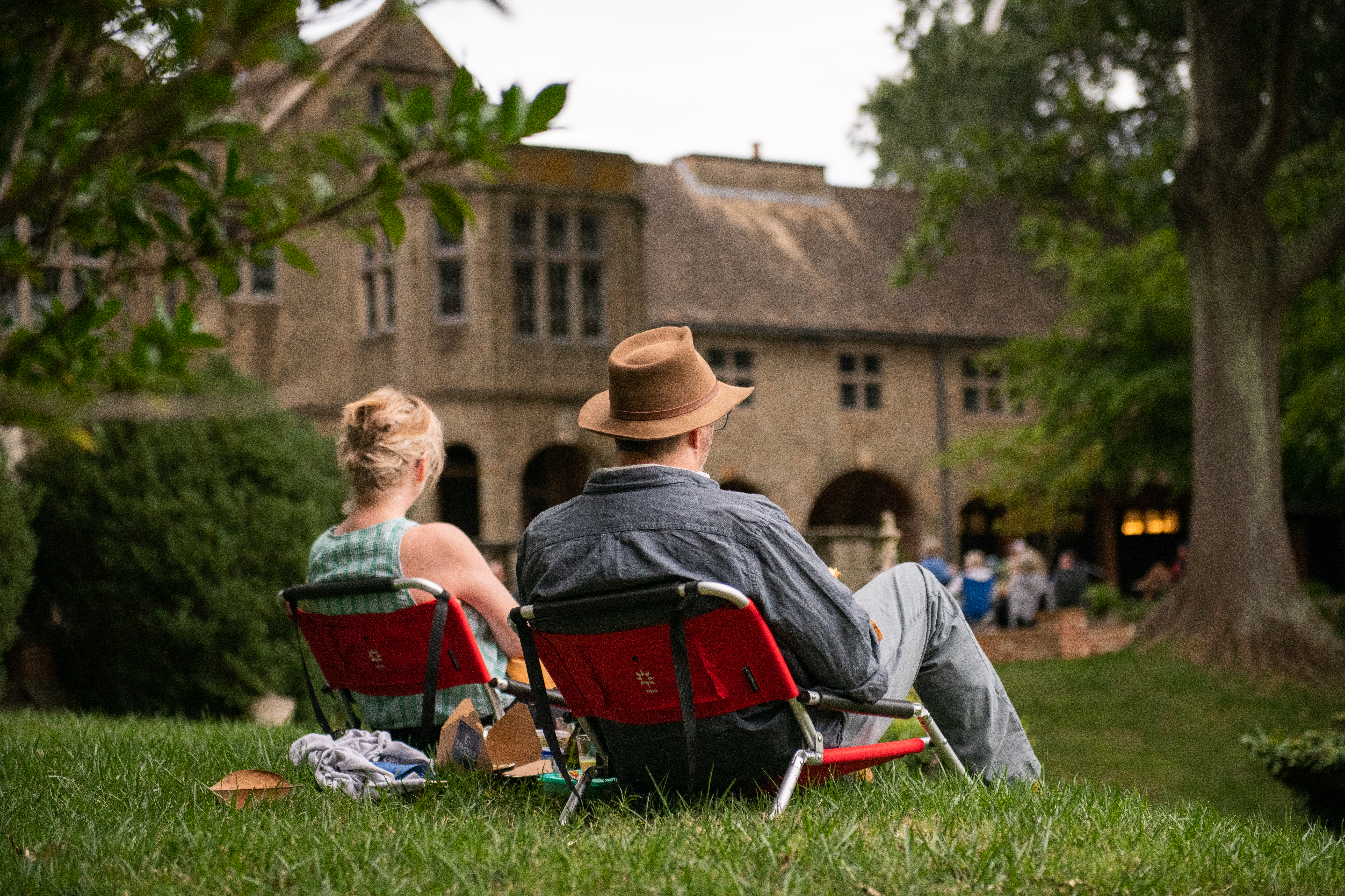 two people sitting in lawn chairs viewing the gardens of Virginia House