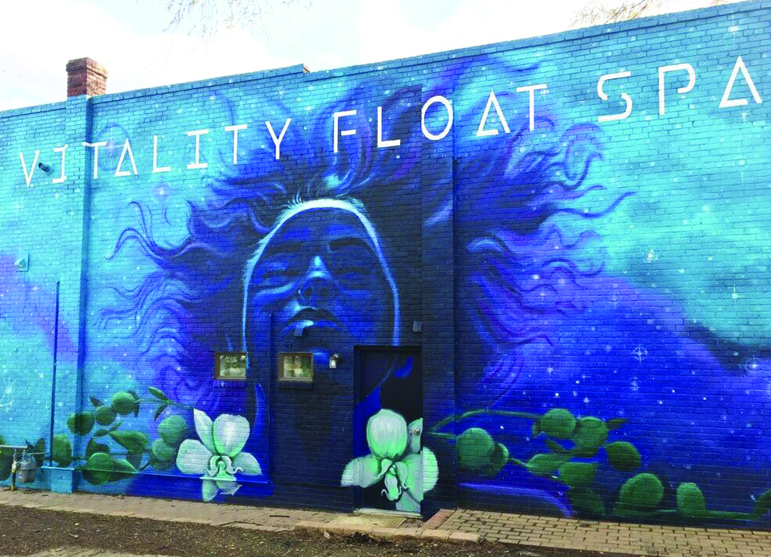 A mural by Nico Cathcart on the side of Richmond's Vitality Float Spa.