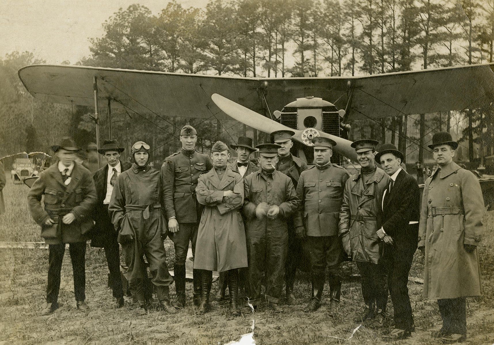 Photograph of Lt. Sylvanus Ingram and an early biplane, about 1918–1920 (VHS 2006.177.1_v1)