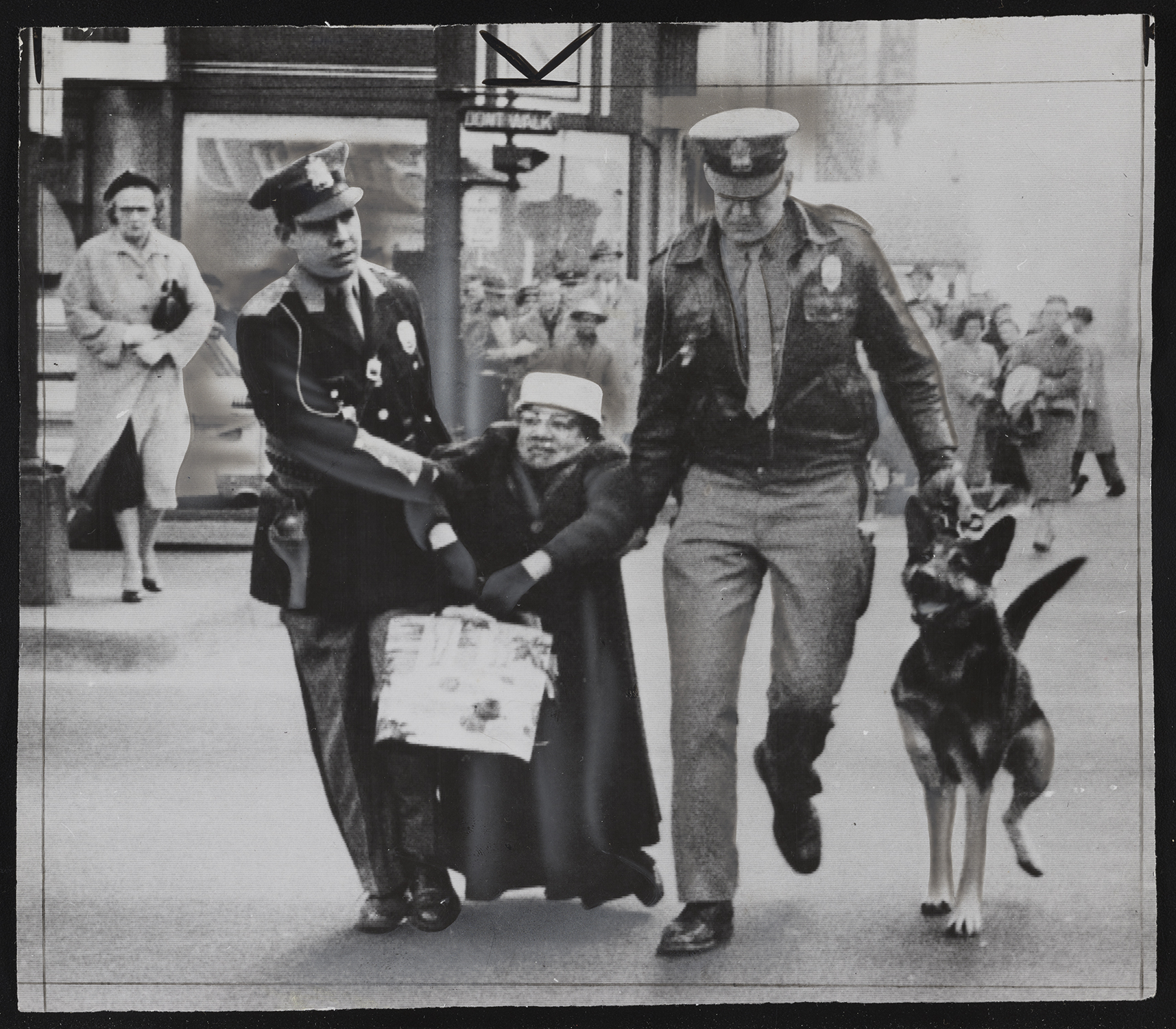 Photograph of Ruth Tinsley in Richmond being dragged by police. 