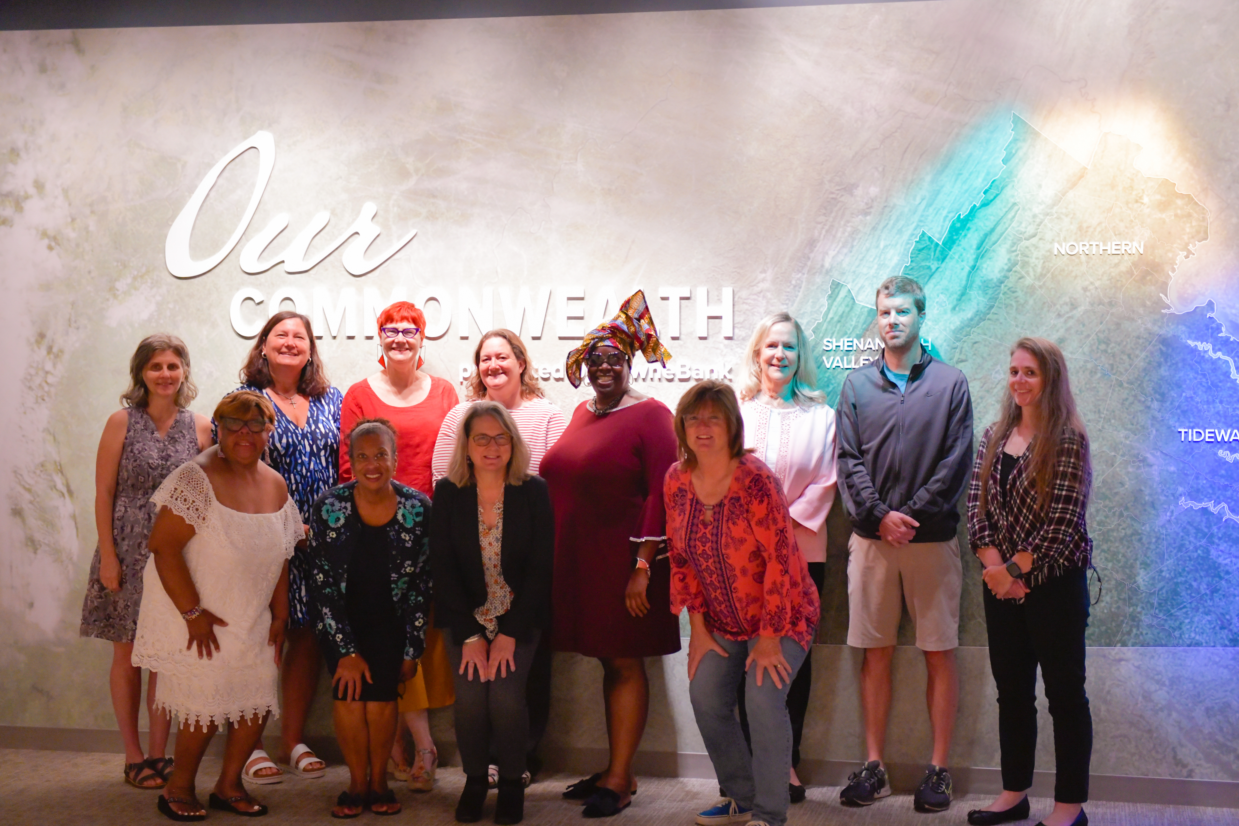 A group of teachers pose in the Our Commonwealth Gallery at VMHC