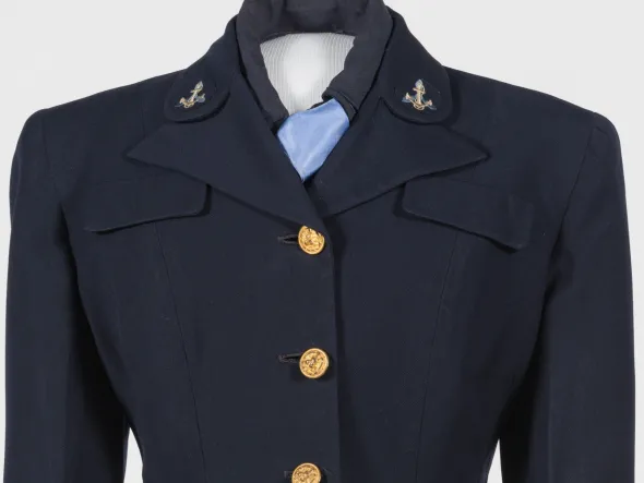 US Navy WAVE uniform. Navy blue jacket with gold buttons and anchor emblem on collar