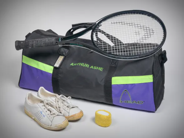 Arthur Ashe's tennis gear Tennis raquet, sports bag and shoes - belonged to Arthur Ashe
