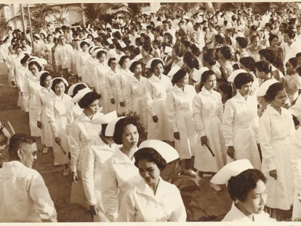 Photograph of Araceli Marcial and her cohort during the Chinese General Hospital School of Nursing graduation march