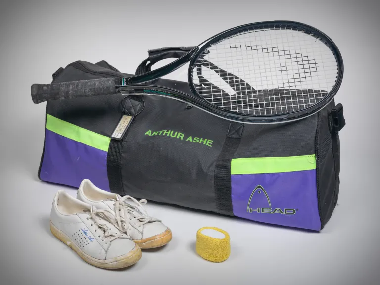 Tennis raquet, sports bag and shoes - belonged to Arthur Ashe