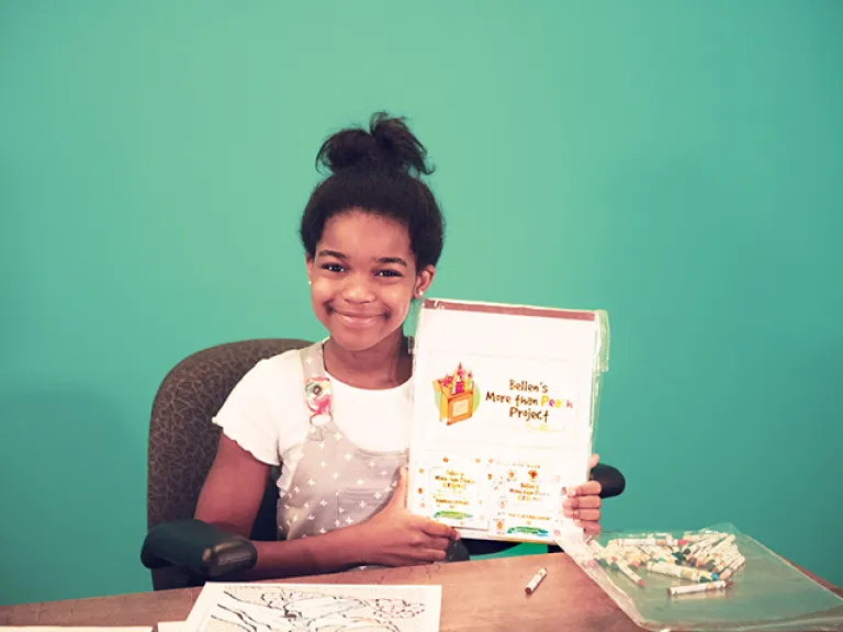 Changing the Commonwealth with Crayons A photograph of Bellen Woodard and her More Than Peach Project.