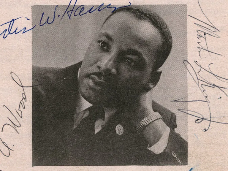 Black and white photograph of Dr. Martin Luther King, Jr. and five signatures (clockwise from top right): Martin L. King, Jr.; Wyatt Tee Walker; Ralph Abernathy; Virgil A. Wood; Curtis W. Harris.