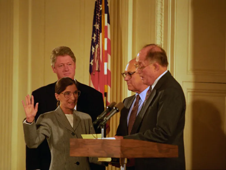 Chief Justice William Rehnquist swearing in Ruth Bader Ginsburg as an Associate Justice of the Supreme Court while President Bill Clinton and Ginsburg’s husband, Martin Ginsburg, look on, 8/10/1993.