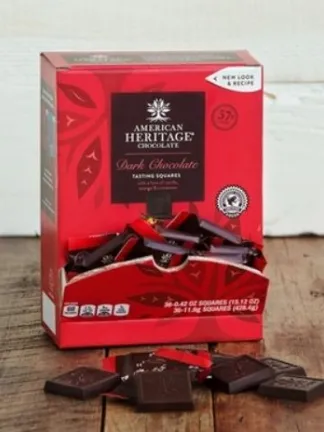 American Heritage Chocolate Tasting Squares A red box of American Heritage Chocolate squares on a wooden table