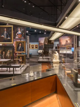 Story of Virginia Gallery in VMHC. View shows colonial portraits in background and glass cases in foreground