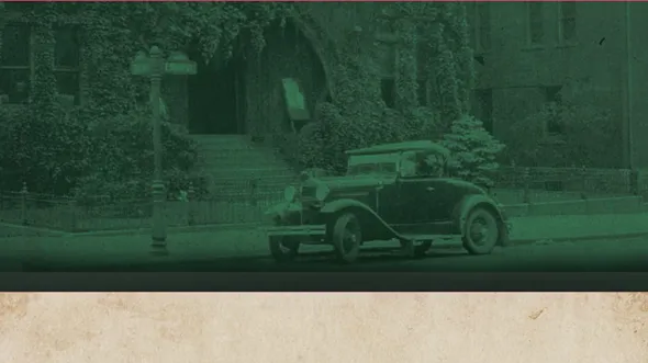 A green toned photograph of a 1940s era car in front of a stone building