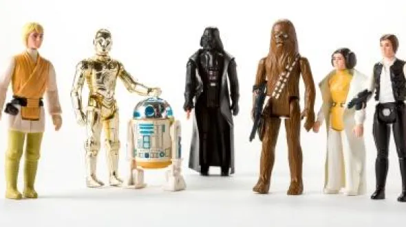 A set of Star Wars Figurines, including Luke Skywalker, C-3PO, R2-D2, Darth Vader, Chewbacca, Princess Leia, and Han Solo