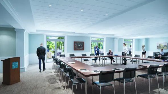 A rendering of a meeting room with tables and chairs arranged in a square in the center of a windowed room.