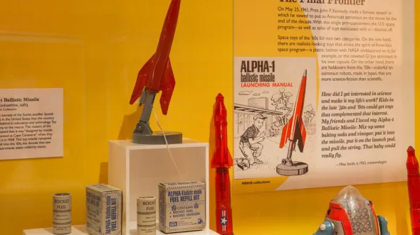 The Alpha-1 Ballistic Missile toy in a display case with wall labels