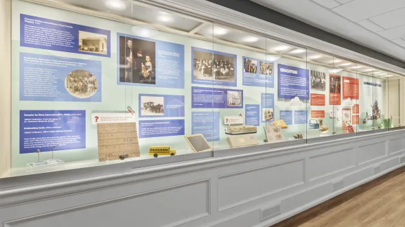 A display case with artifacts related to kids in Virginia history