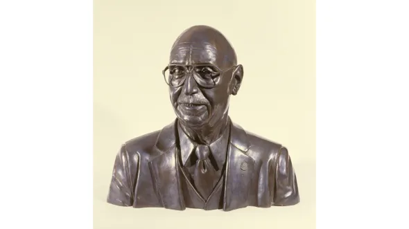 A color photograph of a bust of Oliver W. Hill 