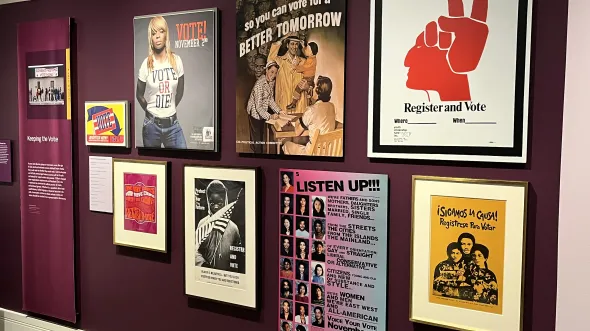 A gallery wall of posters and advertisements
