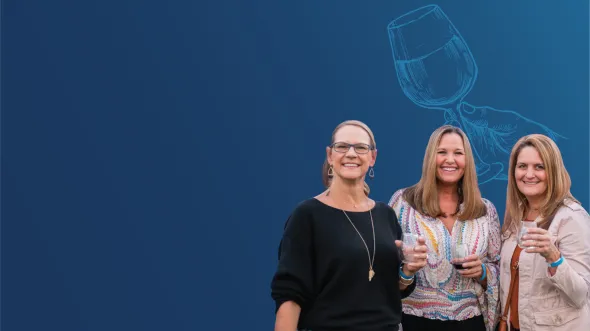 Three smiling people hold glasses of wine in front of a blue background with an icon of a hand holding a wine glass