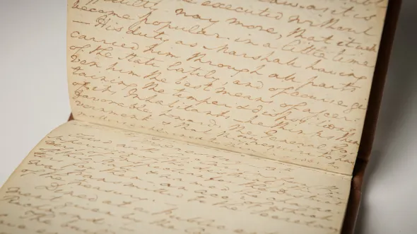 A close up of open pages with cursive handwriting in the diary of George Washington