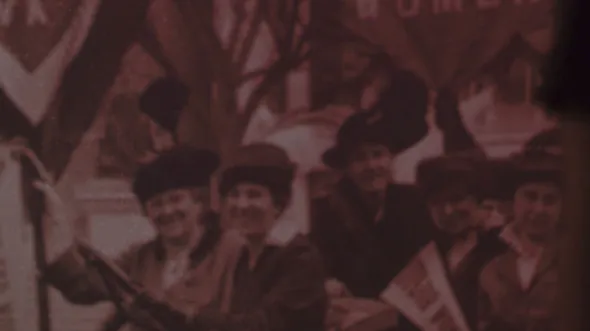 A sepia photograph of women holding Suffrage banners
