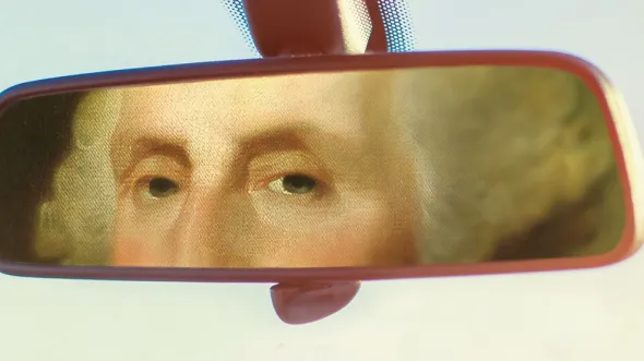 An illustration of George Washington in a car review mirror