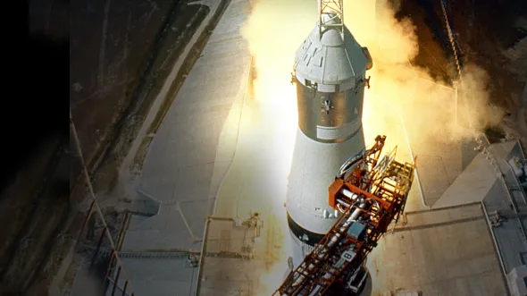 Apollo: When We Went to the Moon A rocket launching from a launch pad