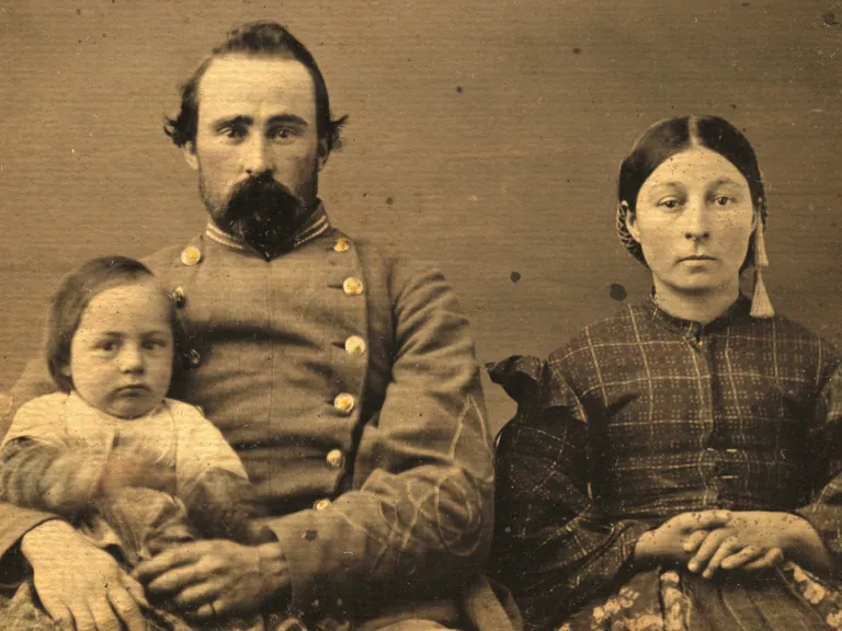 A sepia photo of a family in Civil War attire
