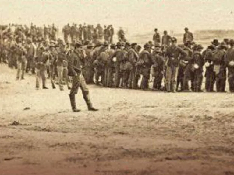 A sepia toned photo of military troops lined up