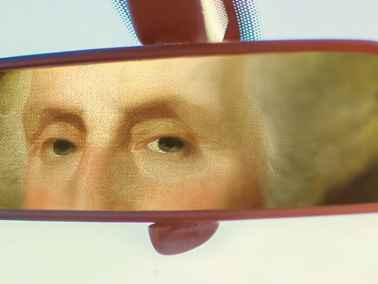 An illustration of George Washington in a car review mirror