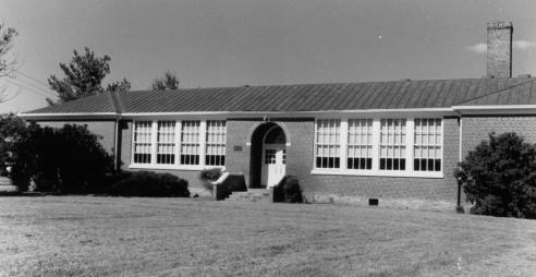 Black and white photograph of the façade of Robert Russa Moton High School