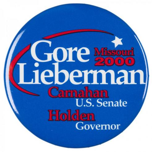 Blue button with the text, “Gore Lieberman / Missouri 2000 / Carnahan U.S. Senate / Holden Governor.”