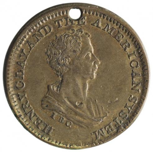 A brass or copper medalet with the words, “Henry Clay and the American System” engraved around the portrait of the side profile of Clay.     